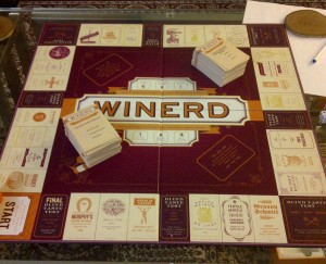 The WINERD board game setup. Guests are in the other room taking notes because they won't be seeing the wines again once the game is underway. The teams will taste the wines blinded when they land on each of the eight burgundy blind taste test spaces.